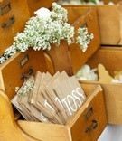 Petal Toss Bags
Photography: Bob %26 Dawn Davis Photography
Read More:
http://www.insideweddings.com/weddings/ashley-hebert-and-jp-rosenbaum/438/ Antique library drawers filled with flower petals
