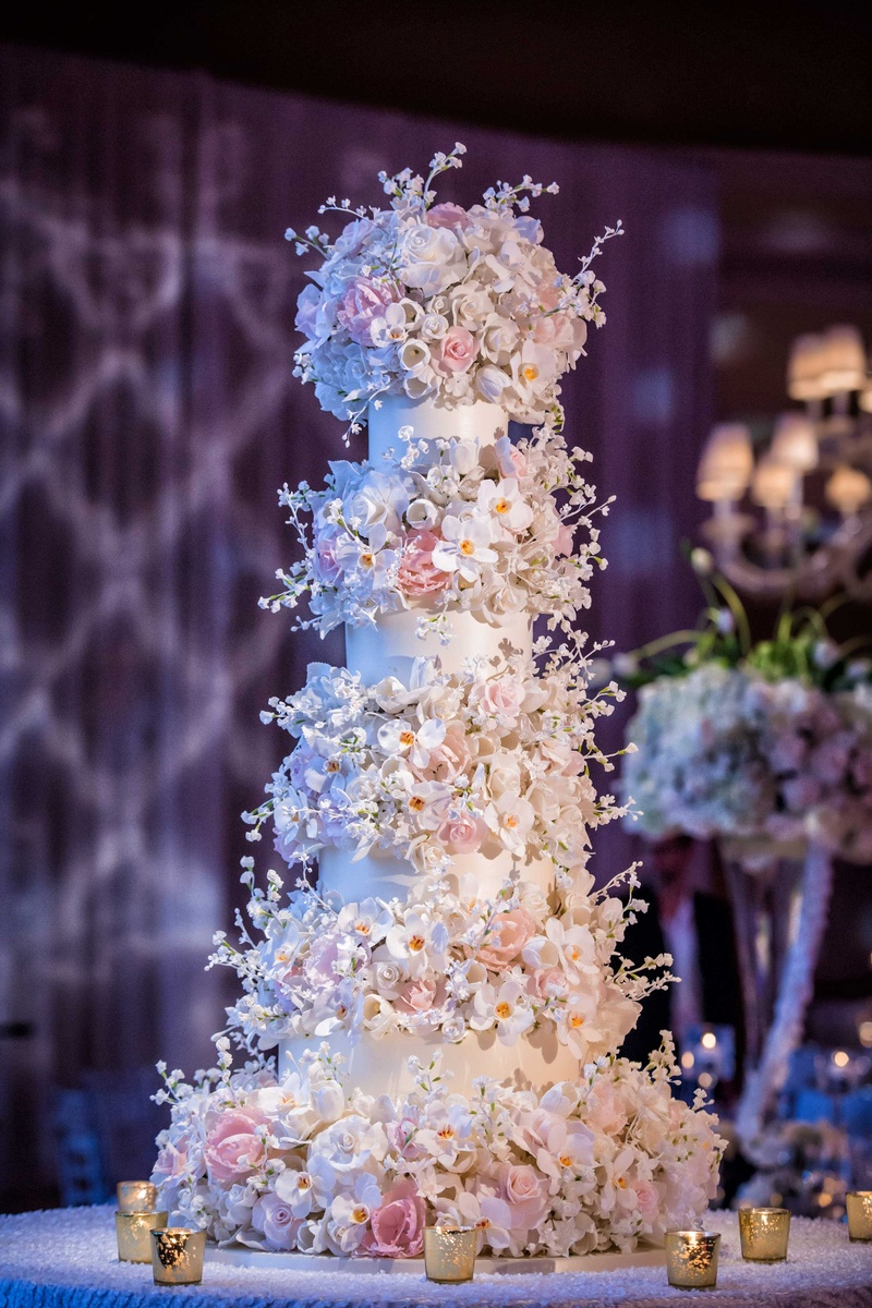 Towering 50-Inch Wedding Cake
Photography: Muñoz Photography
Read More:
http://www.insideweddings.com/weddings/colorful-jewish-ceremony-ballroom-reception-at-the-breakers/818/ Sylvia Weinstock wedding cake at reception at The Breakers fifty inches high sugar flowers peony