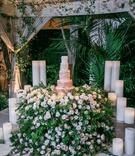Ombré Ruffled Wedding Cake
Photography: Jessica Claire Photography
Read More:
http://www.insideweddings.com/weddings/destination-la-wedding-with-natural-rustic-organic-decor/1134/ wedding reception cake table with hundreds of flowers greenery ombre ruffle wedding cake tent