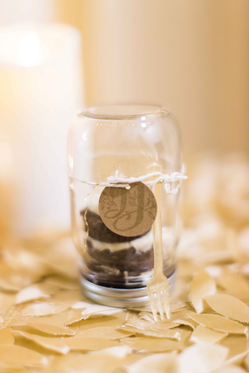 Cake in a Jar Favor with Little Fork
Photography: Gabe Aceves Photography
Read More:
http://www.insideweddings.com/weddings/warm-cozy-wedding-at-unique-warehouse-venue-in-washington-dc/902/ Mason jar with mini cake and monogram tag tied with twine and small fork