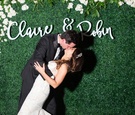 Newlyweds Kiss In Front of The Names