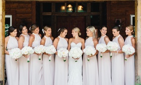 Bridesmaids with Flowers in Hair
Photography: Kate Osborne Photography
Read More:
http://www.insideweddings.com/weddings/stylish-destination-wedding-with-gorgeous-blooms-in-sundance-utah/1008/ High neck halter gown bridesmaid dresses in pale pastel hue white flowers and flowers in hair
