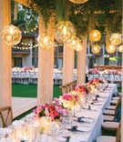 Greenery %26 Lighting Over Long Table
Photography: Bryan Miller Photography
Read More:
http://www.insideweddings.com/weddings/church-ceremony-tropical-outdoor-reception-in-san-diego/1192/ Wood structure with lantern pendants greenery string lights pink flowers candlelight long table