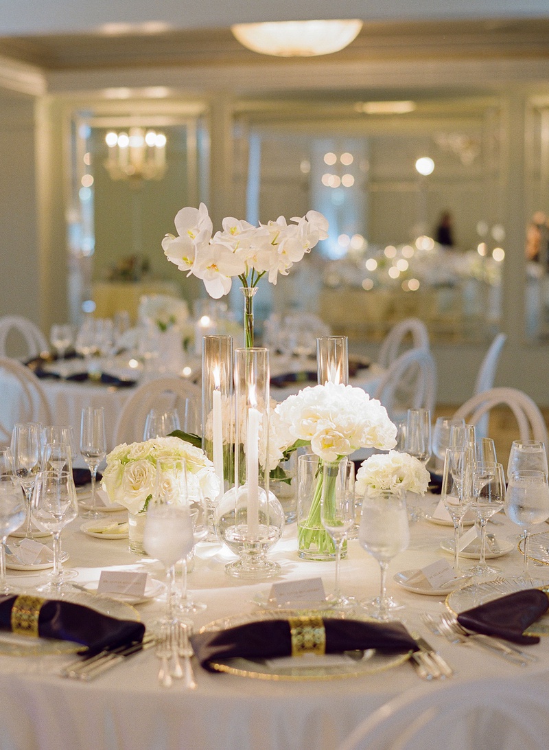 White Single Flower-Type Arrangements
Photography: Michelle Beller Photography
Read More:
http://www.insideweddings.com/weddings/classic-ceremony-beachfront-ballroom-reception-in-santa-monica/1234/ wedding reception white flower centerpiece rose hydrangea orchid napkin gold ring hotel casa del mar