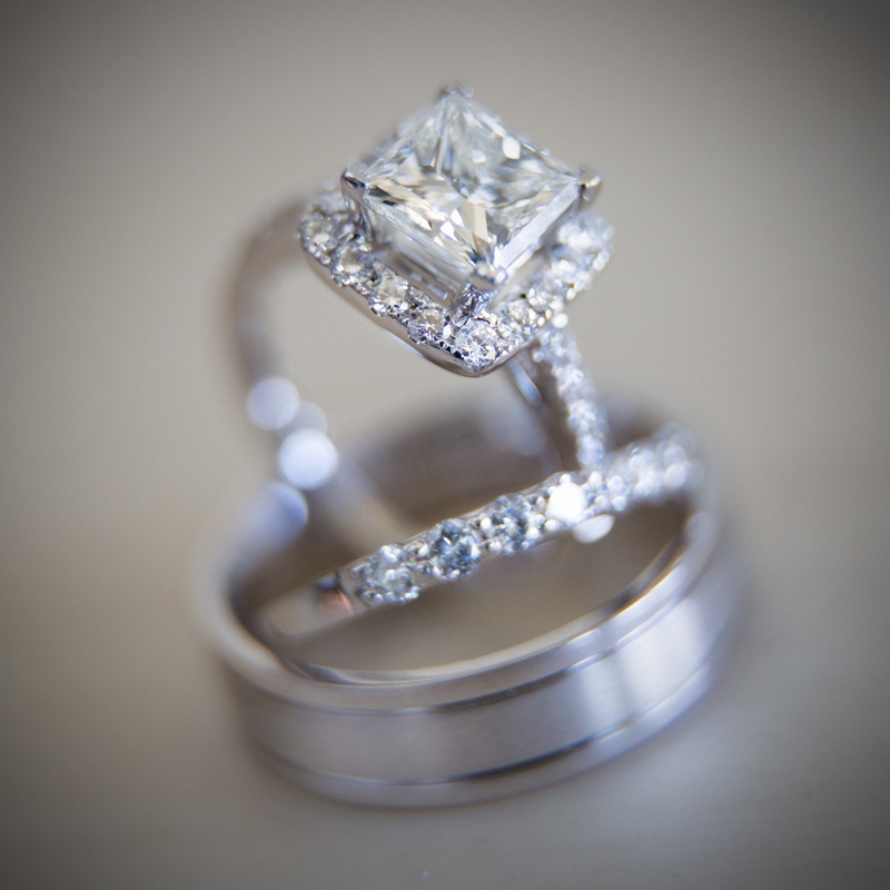 Princess-Cut Engagement Ring with Halo
Photography: Jay Lawrence Goldman Photography
Read More:
http://www.insideweddings.com/weddings/elegant-white-lavender-ballroom-wedding-with-cherry-blossom-trees/710/ Marina Diamonds & Jewelry princess cut diamond engagement ring with halo and wedding bands