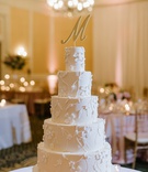 Classic Cake with Initial Cake Topper
Photography: Caroline Lima Photography
Read More:
http://www.insideweddings.com/weddings/catholic-ceremony-classic-ballroom-reception-in-charlotte-nc/1314/ wedding reception ballroom five layer wedding cake flower vine design large initial cake topper