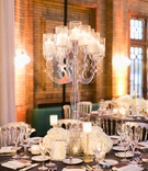 Acrylic Candelabra with White Flowers
Photography: Artistrie Co.
Read More:
http://www.insideweddings.com/weddings/rustic-elegant-celebration-with-personalized-elements-in-chicago/1026/ Round reception table grey linen with crystal table number white flowers candles tall lucite candle