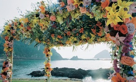 Vibrant Floral Canopy
Photography: Tony Florez Photography
Read More:
http://www.insideweddings.com/weddings/colorful-destination-wedding-at-el-careyes-resort-spa-in-mexico/57/ El Careyes Resort & Spa oceanfront ceremony décor