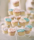 Tower of Pastel Cupcakes
Photography: Milton Photography
Read More:
http://www.insideweddings.com/weddings/inspirational-pastel-wedding-at-a-french-chateau-in-paris-france/650/ Wedding cupcakes topped with white, blue and pink frosting
