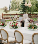 Wedding with Stand-Up Chandeliers
Photography: Our Two Hearts
Read More:
http://www.insideweddings.com/weddings/romantic-whimsical-outdoor-garden-wedding-reception-inspiration/1319/ wedding reception stand up chandelier white table french upholster chairs pink centerpiece greenery