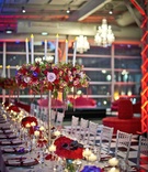Tall, Colorful Centerpieces with Candles
Photography: Lindsay Muciy Photography
Read More:
http://www.insideweddings.com/weddings/vibrant-florals-dramatic-details-at-montreal-wedding/918/ tall centerpieces with red and pink flowers, fake candles, king's table long reception table