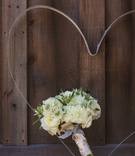 White Bridal Bouquet
Photography: Mischa Photography
Read More:
http://www.insideweddings.com/weddings/heartwarming-ranch-wedding-with-sophisticated-rustic-details/673/ Bride's bouquet of white flowers with greenery, bound by white ribbon, against wood barn door