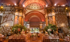 Whimsical Indoor Wedding Reception
Photography: Maya Myers Photography
Read More:
http://www.insideweddings.com/weddings/whimsical-wedding-with-colorful-flowers-in-brooklyn-new-york/1131/ Wedding reception lighting projections vines trees weylin brooklyn greenery bright flowers