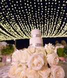 Mini Cake for Cutting
Photography: Simone Photography
Read More:
http://www.insideweddings.com/weddings/tropical-destination-wedding-at-a-beach-house-in-cabo-san-lucas/1080/ mini wedding cake with silver details on bed of ivory roses