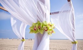 Beach Ceremony Structure
Photography: David Michael Photography
Read More:
http://www.insideweddings.com/weddings/cool-classic-california-wedding-with-unique-guestbook/249/ White drapery on beach ceremony altar with orchids