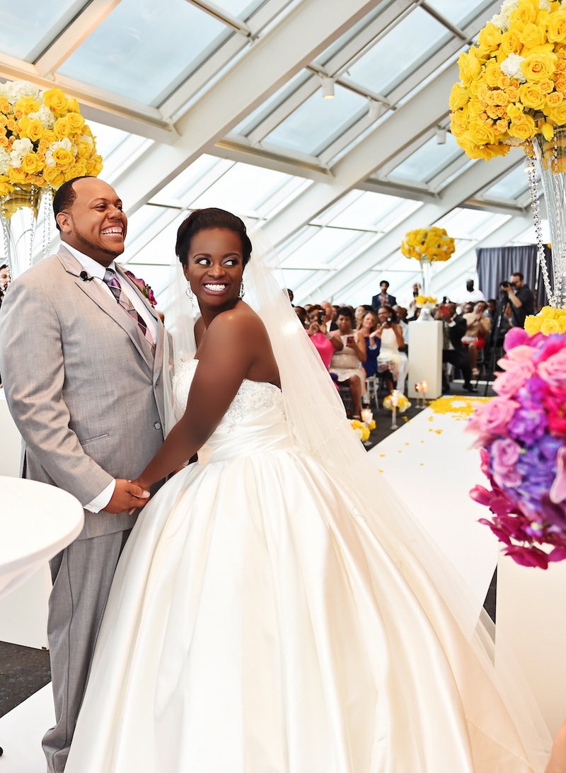 Bride %26 Groom at Ceremony
Photography: Carasco Photography
Read More:
http://www.insideweddings.com/weddings/city-wedding-at-chicago-planetarium-with-purple-yellow-palette/688/ Bride in a strapless Pnina Tornai dress with beaded & ruched bodice, veil, holds hands with groom