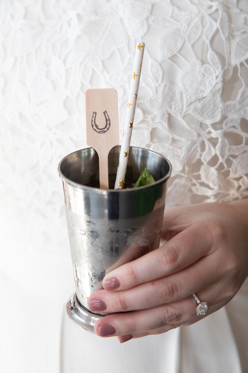 Mint Julep at Bridal Shower
Photography: Collin Pierson Photography
Read More:
http://www.insideweddings.com/weddings/equestrian-themed-bridal-shower-inspired-by-the-kentucky-derby/1326/ mint julep with paper straw and wooden stir stick with horse shoe