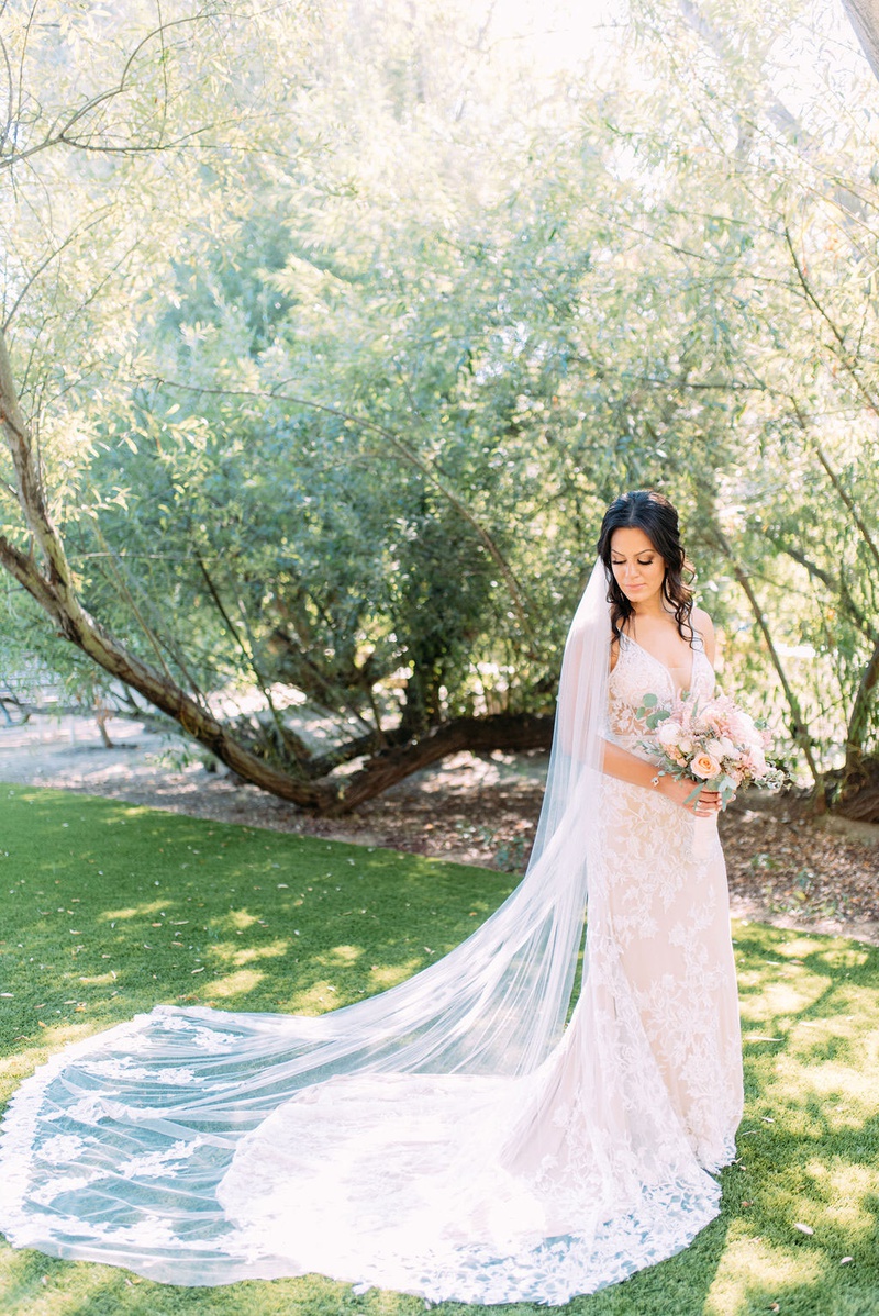 Bride with Beautiful Veil, Gown %26 Bouquet
Photography: Ashley Paige Photography
Read More:
http://www.insideweddings.com/weddings/elegant-outdoor-fall-wedding-at-a-rustic-chic-venue-in-malibu/1244/ bride in calla blanche wedding dress train bouquet muted color palette long cathedral veil