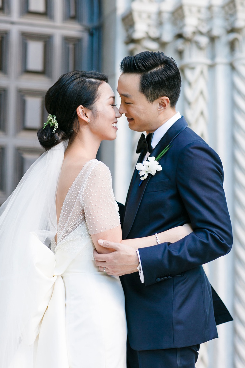 Kristin Kim %26 Anthony Yu
Photography: Michelle Beller Photography
Read More:
http://www.insideweddings.com/weddings/classic-ceremony-beachfront-ballroom-reception-in-santa-monica/1234/ bride with low bun and veil below with pretty bow dress and ceremony top groom in navy blue suit
