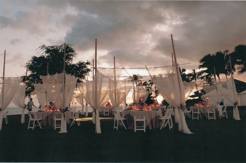 Tropical Outdoor Ceremony
Photography: David Michael Photography
Read More:
http://www.insideweddings.com/weddings/tropical-seaside-wedding-in-lanai-hawaii/60/ tables chairs and drapery on green lawn overlooking ocean