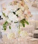 Summer Floral Centerpiece
Photography: Carrie Rodman Photography
Read More:
http://www.insideweddings.com/weddings/new-england-summer-wedding-by-the-seashore/429/ Crystal candlestick with white and pink roses and peonies