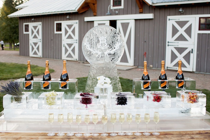 Champagne Ice Sculpture Bar
Photography: Perez Photography
Read More:
http://www.insideweddings.com/weddings/incredible-tented-ceremony-barn-reception-at-ranch-in-aspen/860/ Ice sculpture Champagne bar with garnishes and fruit in ice blocks cocktail hour