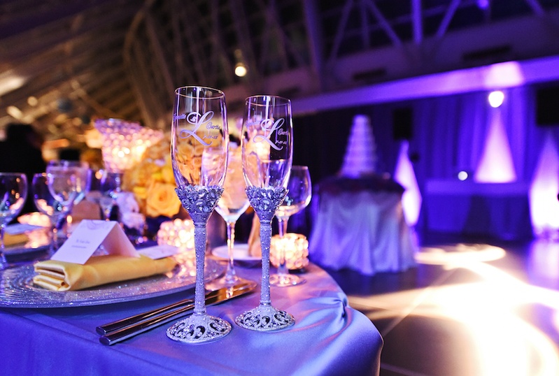 Glitzy Champagne Flutes
Photography: Carasco Photography
Read More:
http://www.insideweddings.com/weddings/city-wedding-at-chicago-planetarium-with-purple-yellow-palette/688/ Bride and groom's Champagne flutes with silvery, jeweled stems, couple's names at Adler Planetarium