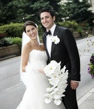 The Bride and Groom
Photography: KingenSmith
Read More:
http://www.insideweddings.com/weddings/romantic-all-white-celebration-in-chicago-illinois/315/ Couple holding orchid bouquet and boutonniere