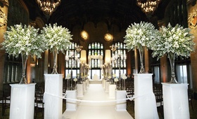 White Ceremony Décor
Photography: KingenSmith
Read More:
http://www.insideweddings.com/weddings/romantic-all-white-celebration-in-chicago-illinois/315/ Green and ivory flowers on pedestals