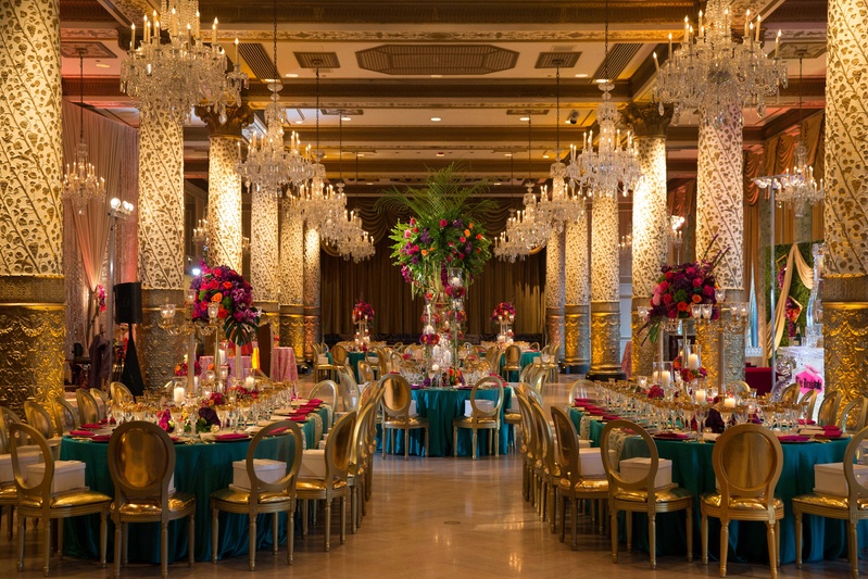Opulent "Marrakesh" Motif in Reception Space
Photography: Collin Pierson Photography
Read More:
http://www.insideweddings.com/weddings/bold-and-bright-wedding-styled-shoot-inspired-by-marrakesh-morocco/825/ opulent and vast gold turquoise color palette with differing sizes of floral arrangements