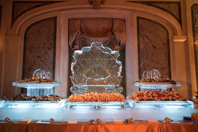 Seafood Station with Ice Sculpture
Photography: The Day by Ira Lippke
Read More:
http://www.insideweddings.com/weddings/opulent-luxury-wedding-with-timeless-color-palette-in-new-york-city/1199/ seafood station ice sculpture with monogram shrimp and other shellfish