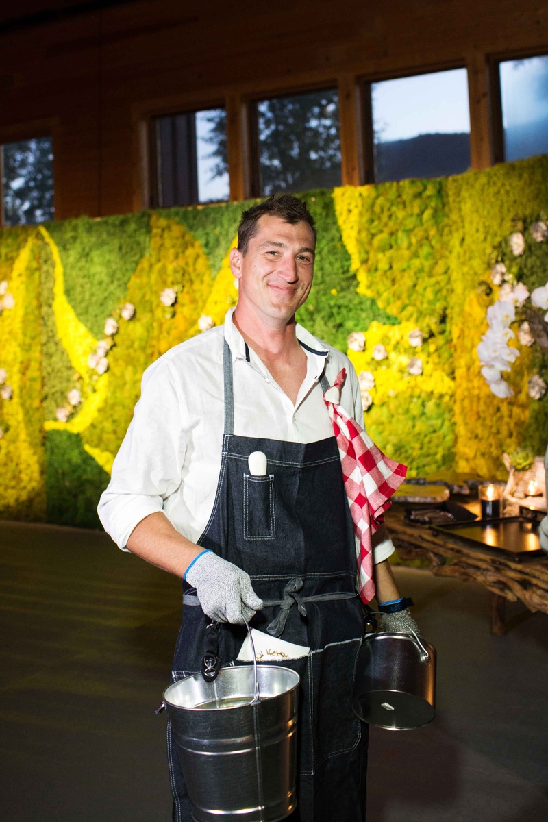 Oyster Shucker Server
Photography: Perez Photography
Read More:
http://www.insideweddings.com/weddings/incredible-tented-ceremony-barn-reception-at-ranch-in-aspen/860/ Cocktail hour oyster shucker in overalls with red white picnic blanket napkin succulent moss wall