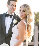Bride in Gorgeous Gown with Pearls
Photography: Samuel Lippke Studios
Read More:
http://www.insideweddings.com/weddings/alfresco-ceremony-with-ocean-view-glamorous-tented-reception/1081/ Groom smiles at bride long blonde hair with pearls draping along low back lace galia lahav open back