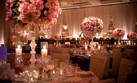 Pink Floral Centerpieces
Photography: John Solano Photography
Read More:
http://www.insideweddings.com/weddings/modern-indian-wedding-in-beverly-hills-california/337/ Gold chair covers and blush roses in candelabra