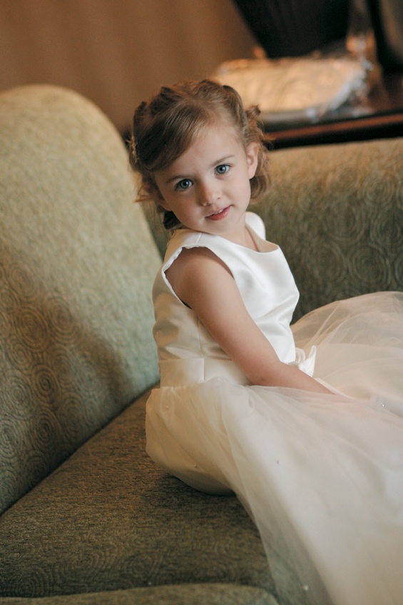 White Flower Girl Dress
Photography: Karen French Photography
Read More:
http://www.insideweddings.com/weddings/romantic-winter-wedding-in-huntington-beach-california/81/ Little girl in ivory dress with hair pulled back