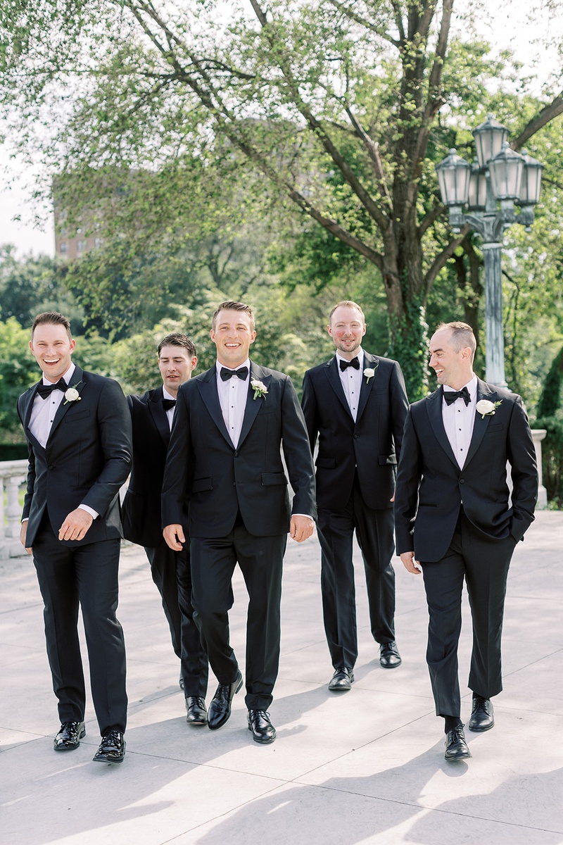 Cleveland Groom %26 Groomsmen
Photography: Lauren Gabrielle Photography
Read More:
http://www.insideweddings.com/weddings/summer-real-wedding-featuring-tropical-decor-at-an-art-museum/1328/ wedding portrait of groom and groomsmen in tuxedos walking at venue cleveland museum of art outdoor