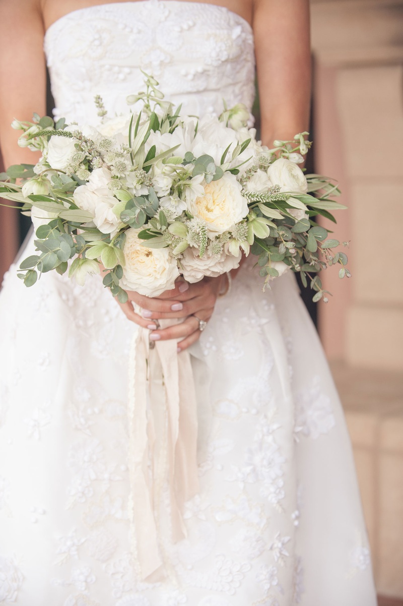 Neutral Bouquet with Ribbons
Photography: Triple Cord Photography
Read More:
http://www.insideweddings.com/weddings/destination-wedding-with-outdoor-reception-lavish-after-party/982/ Neutral bouquet with greenery and garden roses, ranunculus blossoms with dangling ribbon