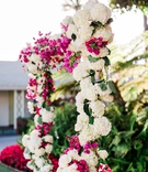 Hydrangea %26 Bougainvillea Arch
Photography: Valorie Darling Photography
Read More:
http://www.insideweddings.com/weddings/santa-monica-wedding-with-tropical-touches-east-coast-inspiration/1232/ wedding ceremony arch with white flowers hydrangeas greenery and pink Bougainvillea flowers outdoor