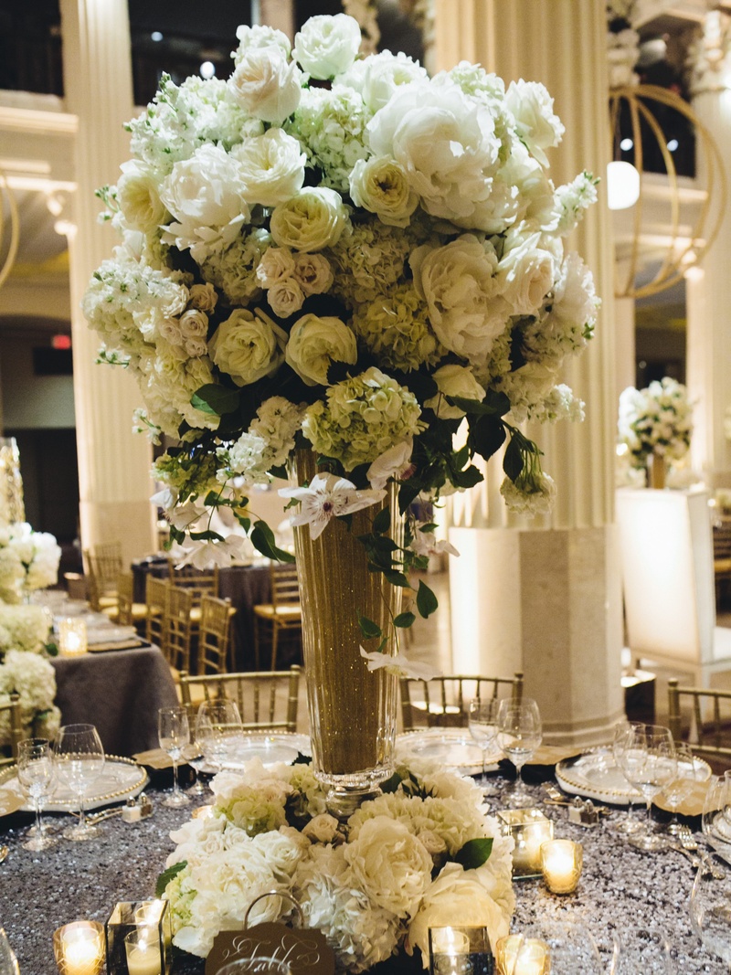 Ivory Floral Centerpiece
Photography: J. Cogliandro Photography
Read More:
http://www.insideweddings.com/weddings/angela-mecca-and-owen-daniels/540/ Gold glitter vase topped with white flowers