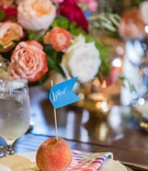 Place Card on Fresh Peach
Photography: Vue Photography
Read More:
http://www.insideweddings.com/weddings/southern-labor-day-weekend-wedding-with-vibrant-color-palette/1342/ wedding reception wood table colorful napkin fresh peach fruit with flag place card