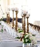 Elegant Carved Candlestands
Photography: Beale %26 Wittig
Read More:
http://www.insideweddings.com/weddings/luxurious-rustic-wedding-at-lakeside-country-club-in-wisconsin/721/ Tented reception with ornate candleholders lined amid white & pink rose table runner