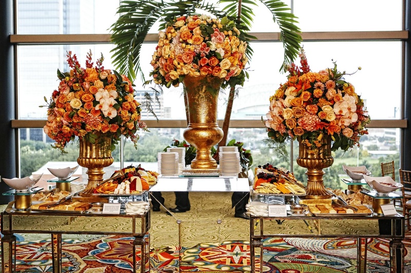 Appetizer Table
Photography: Tomas Ramos Photographers
Read More:
http://www.insideweddings.com/weddings/houston-indian-wedding-celebration-with-800-person-guest-list/435/ Wedding appetizer tables with mirrored panels and golden urns with yellow, orange, and pink flowers
