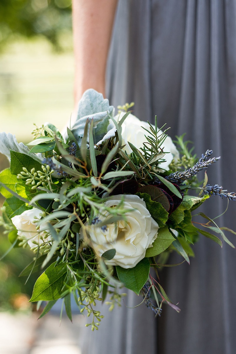 Rustic Bridesmaid Nosegay
Photography: Stacy Newgent
Read More:
http://www.insideweddings.com/weddings/rustic-barn-wedding-tented-reception-on-family-farm-in-ohio/690/ Bridesmaid in grey dress holds green and white bouquet with dusty miller lamb's ear lavender