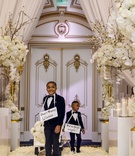 Kids as Ring Bearers with Cute Signs
Photography: Amy Anaiz Photography
Read More:
http://www.insideweddings.com/weddings/luxe-wedding-of-nfl-player-tahir-whitehead-at-elegant-castle-venue/1267/ shannon perkins and tahir whitehead kids wagon cute signs around necks white gold ballroom decor