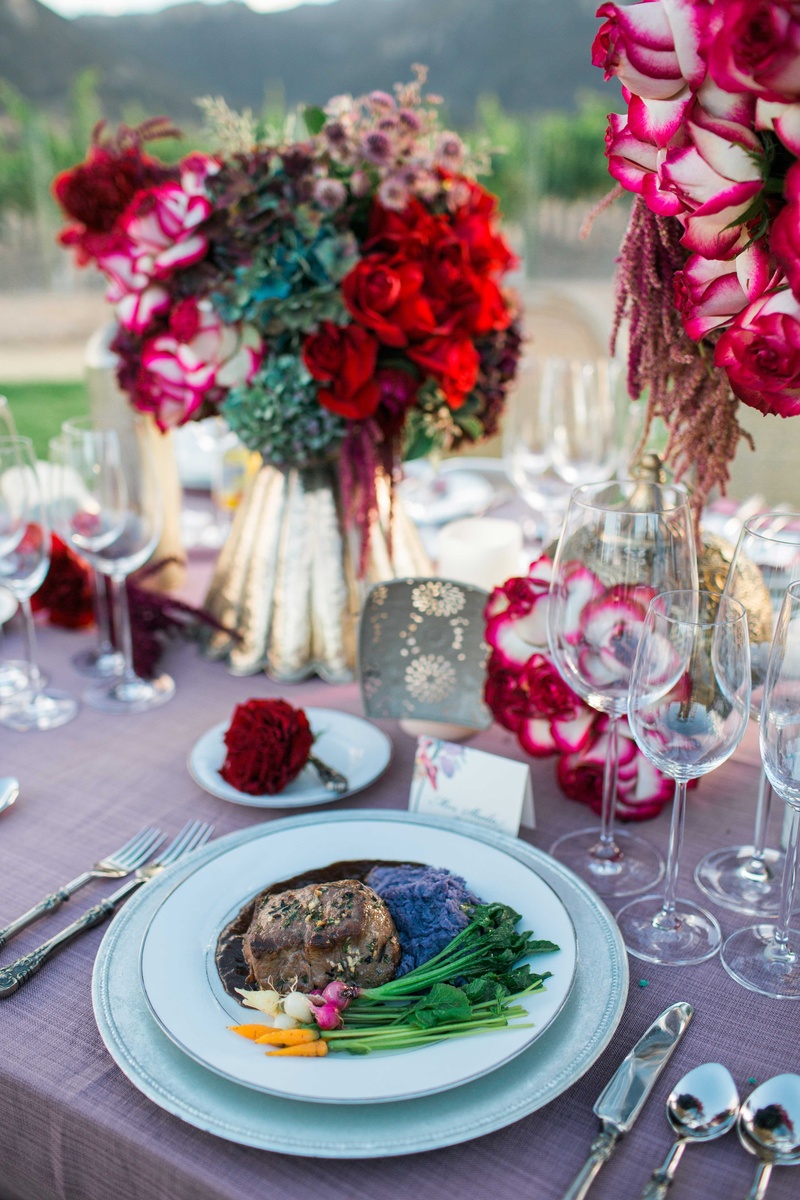 Romantic Tablescape Surrounds Gourmet Meal
Photography: Jenny Quicksall Photography
Read More:
http://www.insideweddings.com/weddings/romantic-wedding-shoot-for-valentines-day-at-california-vineyard/751/ pink table linens gold vases red rose and purple floral arrangements gourmet food steak vineyard