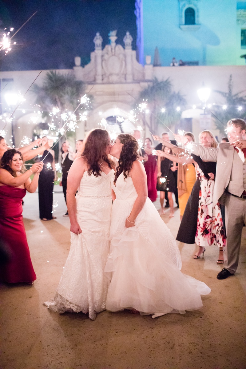 Brides Kiss During Sparkler Exit
Photography: Acqua Photo
Read More:
http://www.insideweddings.com/weddings/balboa-park-wedding-with-wine-inspired-color-scheme-in-san-diego/948/ same-sex wedding, lesbian wedding, bride in winnie couture kissing bride in hayley paige sparklers