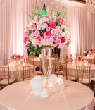 Tall Pink Centerpiece with White Vases
Photography: Perez Photography
Read More:
http://www.insideweddings.com/weddings/church-ceremony-classic-country-club-reception-with-pink-palette/1284/ wedding reception centerpiece with pink roses on clear vase, white vases
