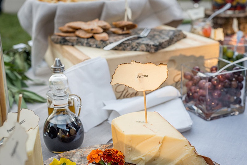 Appetizer Cheese Plate
Photography: Stacy Newgent
Read More:
http://www.insideweddings.com/weddings/rustic-barn-wedding-tented-reception-on-family-farm-in-ohio/690/ Rustic wedding cocktail hour with cheese plate on a wood slab, crostini, olives, balsamic vinegar