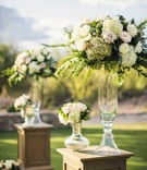 Oak Pedestal with Ivory %26 Pink Flowers
Photography: Trevor Dayley
Read More:
http://www.insideweddings.com/weddings/spring-wedding-at-tuscan-inspired-golf-club-in-scottsdale-arizona/814/ Desert wedding ceremony with oak riser pedestal glass vases white hydrangea, pink rose, greenery