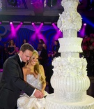 Crystal Cake Cutting
Photography: Fred Marcus Photography
Read More:
http://www.insideweddings.com/weddings/opulent-dallas-texas-wedding-inspired-by-the-gardens-of-versailles/410/ Bride and groom cut seven foot tall wedding cake